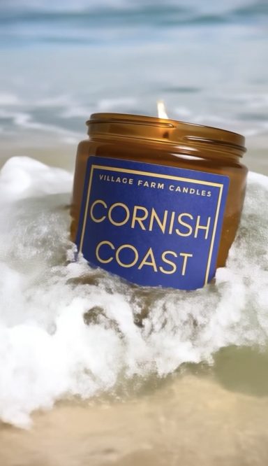 Village Farm’s Cornish Coast Candle blends watery breeze and earthy driftwood, evoking tranquil English shores where cliffs meet golden sand